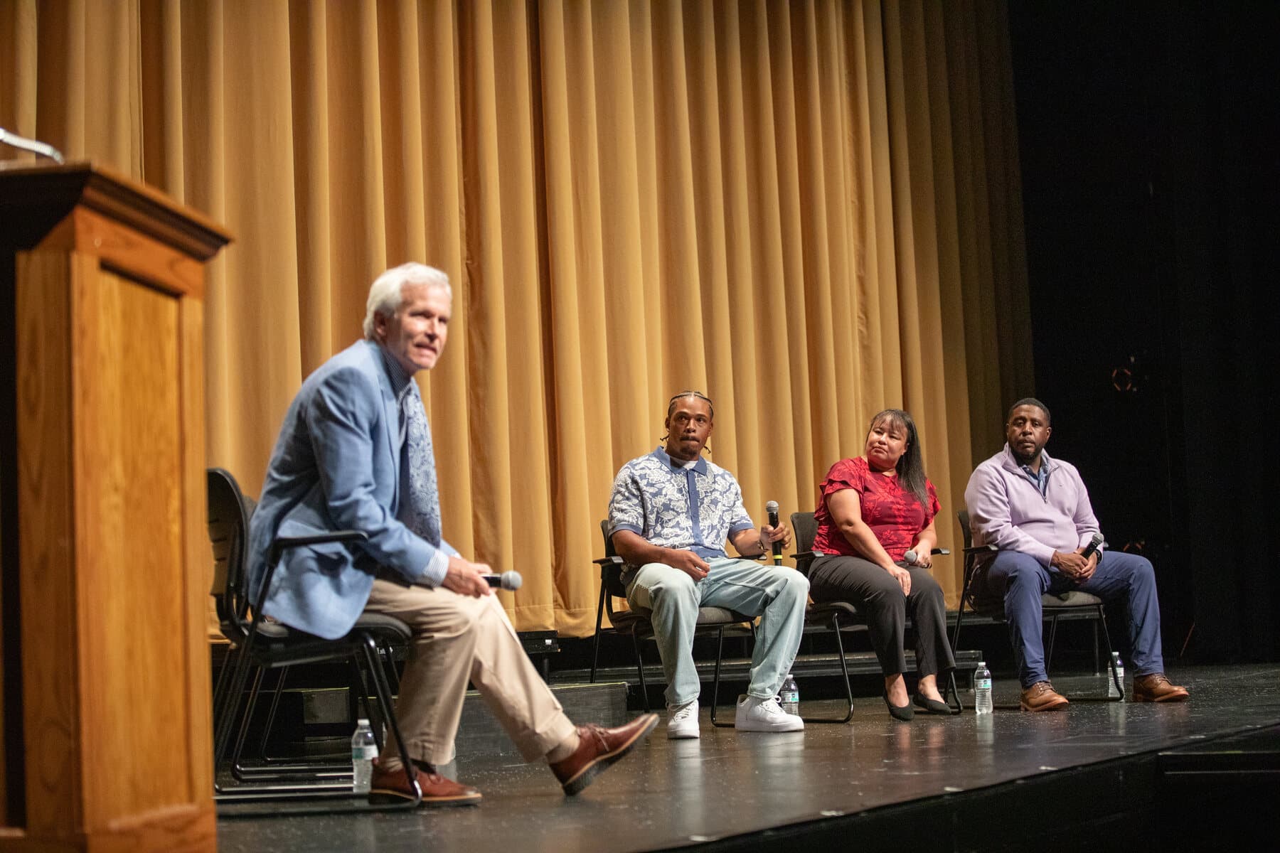 The Our Minds Matter panel on stage at Warren Central Performing Arts Center